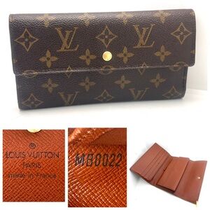 Excellent condition authentic Louis Vuitton Monogram International Wallet MB0022